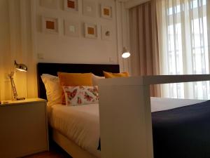 Postel nebo postele na pokoji v ubytování Bellu Suites
