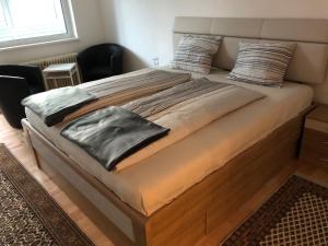 Łóżko lub łóżka w pokoju w obiekcie City Apartments Klinikum
