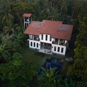 an aerial view of a house with a red roof at Madampe House yummy green Heaven in Ambalangoda