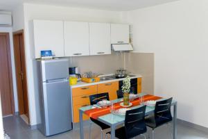 Kuchyň nebo kuchyňský kout v ubytování Apartments 1234