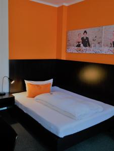 Postel nebo postele na pokoji v ubytování GS Hotel Mindelheim