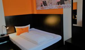 Postel nebo postele na pokoji v ubytování GS Hotel Mindelheim