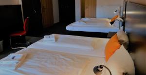 Postel nebo postele na pokoji v ubytování GS Hotel Mindelheim