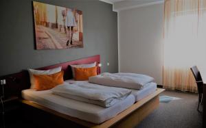 Postel nebo postele na pokoji v ubytování GS Hotel Mindelheim