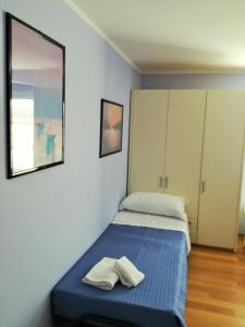 Postel nebo postele na pokoji v ubytování Zaffiro Blu Airport
