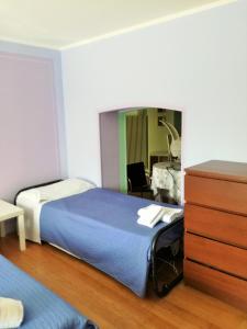 Postel nebo postele na pokoji v ubytování Zaffiro Blu Airport