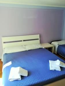 Postel nebo postele na pokoji v ubytování Zaffiro Blu Airport