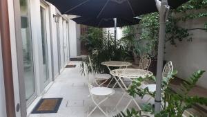 Patio nebo venkovní prostory v ubytování Corte Merighi Charming Rooms