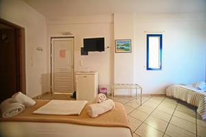 Postel nebo postele na pokoji v ubytování Panorama Elafonisos