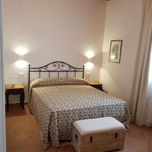 A bed or beds in a room at Agriturismo La Fonte