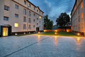 a courtyard of a building with lights on it at Levidom Residence Rooms in Levice