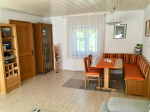 a living room with a table and a couch at Ferienwohnung Karin in Bludenz