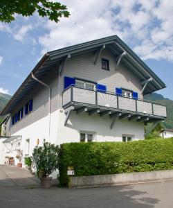 a house with a balcony on the side of it at Ferienwohnung Karin in Bludenz