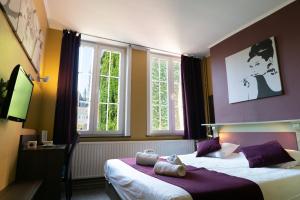 Postel nebo postele na pokoji v ubytování Flandria Hotel