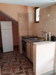Kuchyň nebo kuchyňský kout v ubytování Apartments Vukotic
