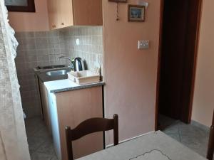 Kuchyň nebo kuchyňský kout v ubytování Apartments Vukotic
