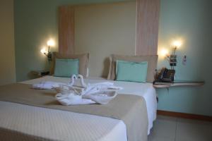 Postel nebo postele na pokoji v ubytování Sol Hotel