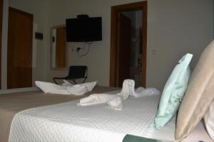 Letto o letti in una camera di Sol Hotel