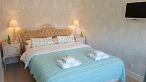 a bedroom with a bed with two pillows on it at Widok na góry in Stronie Śląskie