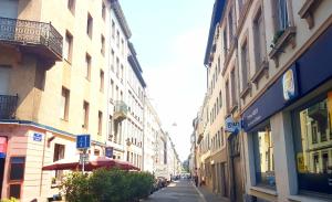 a city street with buildings on the side of the road at Naeva Feng Shui in Strasbourg