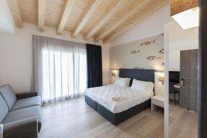 Postel nebo postele na pokoji v ubytování Hotel Columbia & Ninfea