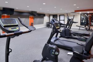a gym with two exercise bikes and a treadmill at Best Western Plus LA Mid-Town Hotel in Los Angeles