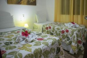 Cama ou camas em um quarto em Pousada Sol e Luna mais 37 fotos