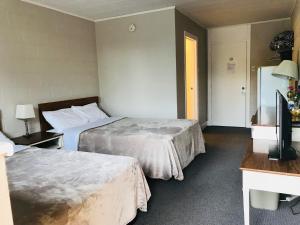 Letto o letti in una camera di Manitou Motor Inn