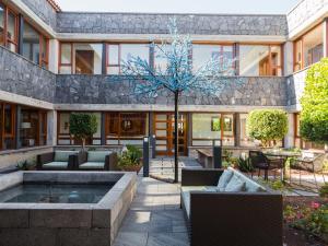 a building with a courtyard with a fountain at La Casona del Patio in Santiago del Teide