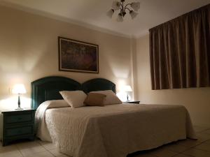Łóżko lub łóżka w pokoju w obiekcie Apartamento Rocas del Mar 130