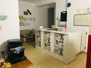 a sewing room with a machine on a counter at Perla in Costinesti