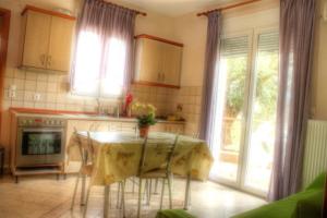 a kitchen with a table with a table cloth on it at Studios Stella in Skala Potamias