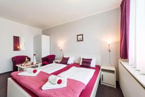 Postel nebo postele na pokoji v ubytování Hotel Racek