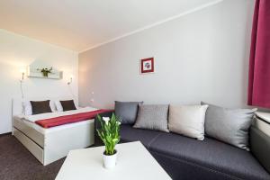 Postel nebo postele na pokoji v ubytování Hotel Racek