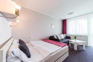 Postel nebo postele na pokoji v ubytování Hotel Racek