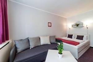 Postel nebo postele na pokoji v ubytování Hotel Racek