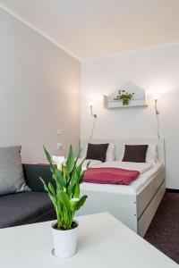 Postel nebo postele na pokoji v ubytování Hotel Racek