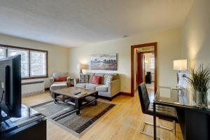 a living room with a couch and a table at Parkside House in Barrie