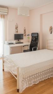A television and/or entertainment centre at Artemis central apartment