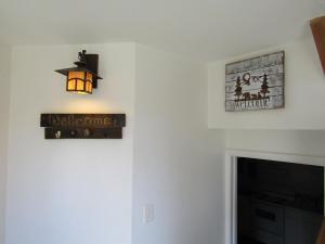 a living room with a christmas sign and a light at Sugar Mountain Drive 1866 Home in Sugar Mountain