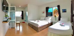 Postel nebo postele na pokoji v ubytování J.Holiday Inn Krabi + 37 fotografií