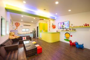 TV a/nebo společenská místnost v ubytování Little Apple B&B