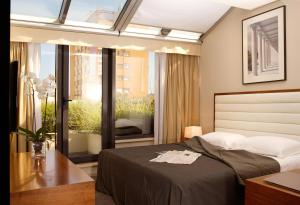 Ένα ή περισσότερα κρεβάτια σε δωμάτιο στο Hotel Atrium