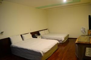 Postel nebo postele na pokoji v ubytování Jia Yuan Homestay
