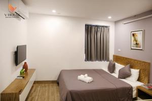 TV a/nebo společenská místnost v ubytování V House 5 Serviced Apartment