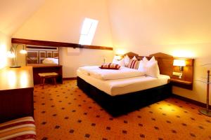 Postel nebo postele na pokoji v ubytování Hotel Fortna