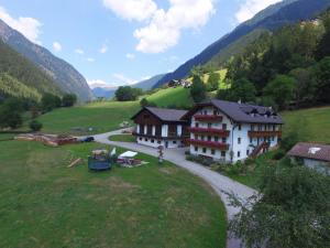 an aerial view of a house in a valley at Hotel Pension Moarhof in Vallarga