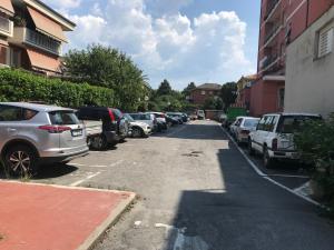 a parking lot with a bunch of parked cars at Il giardino dei limoni in Chiavari