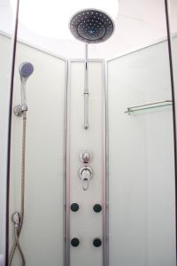 a shower stall with a shower head and a shower at Petra Bubble Luxotel in Wadi Musa