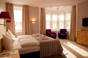 Postel nebo postele na pokoji v ubytování Hotel Rosatsch